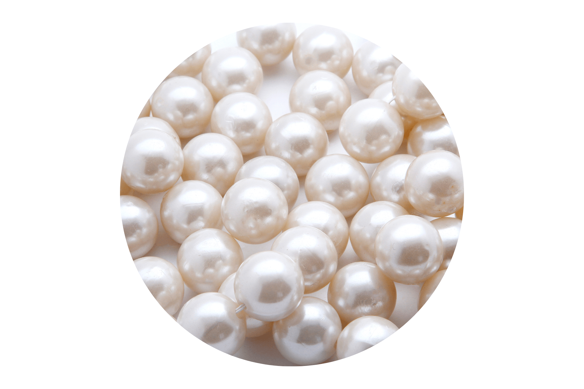 Close-up of white pearls on a white background.
