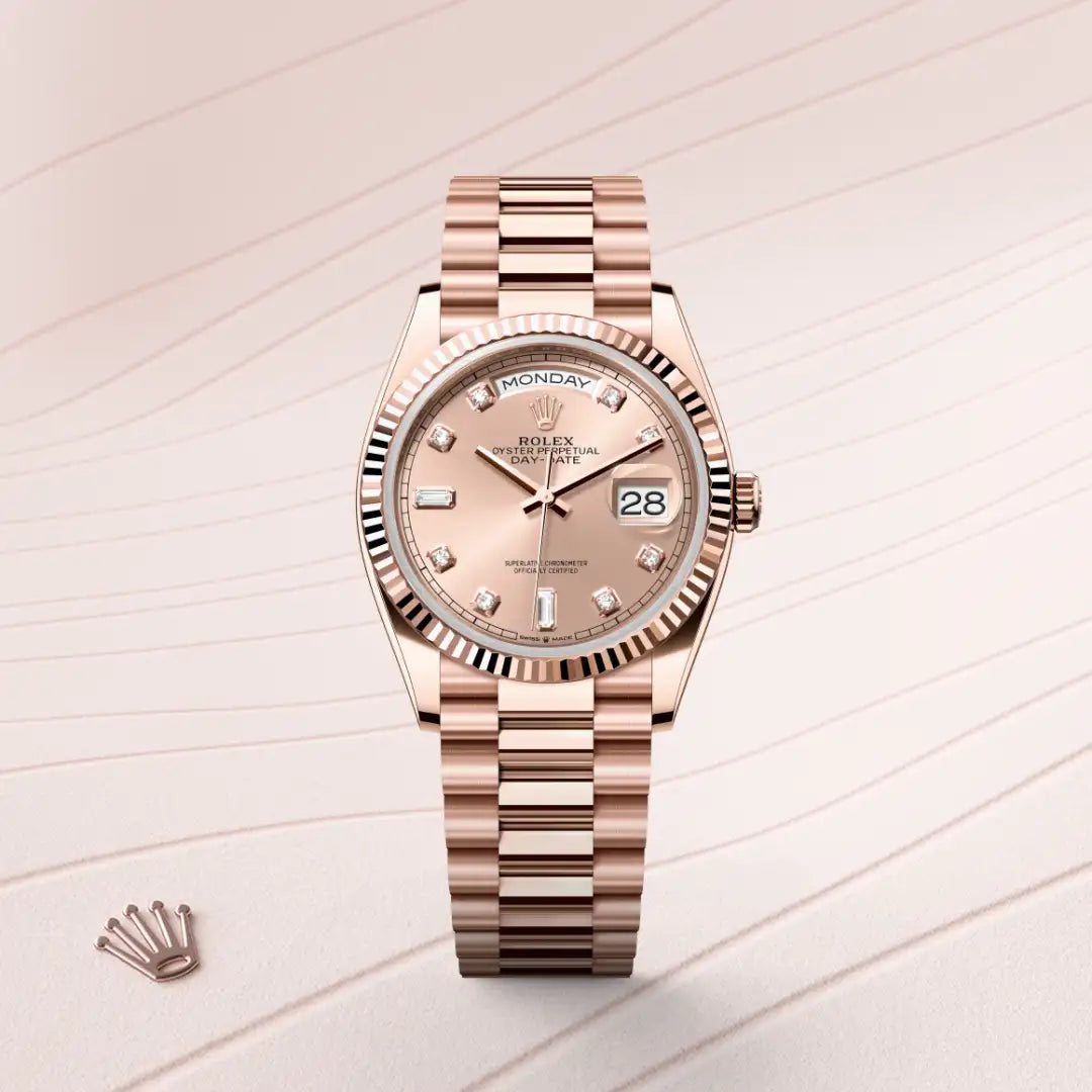 Rolex Day-Date 36 in Everose gold, with a rose-colour dial, fluted bezel, and President bracelet on a rose pink background.