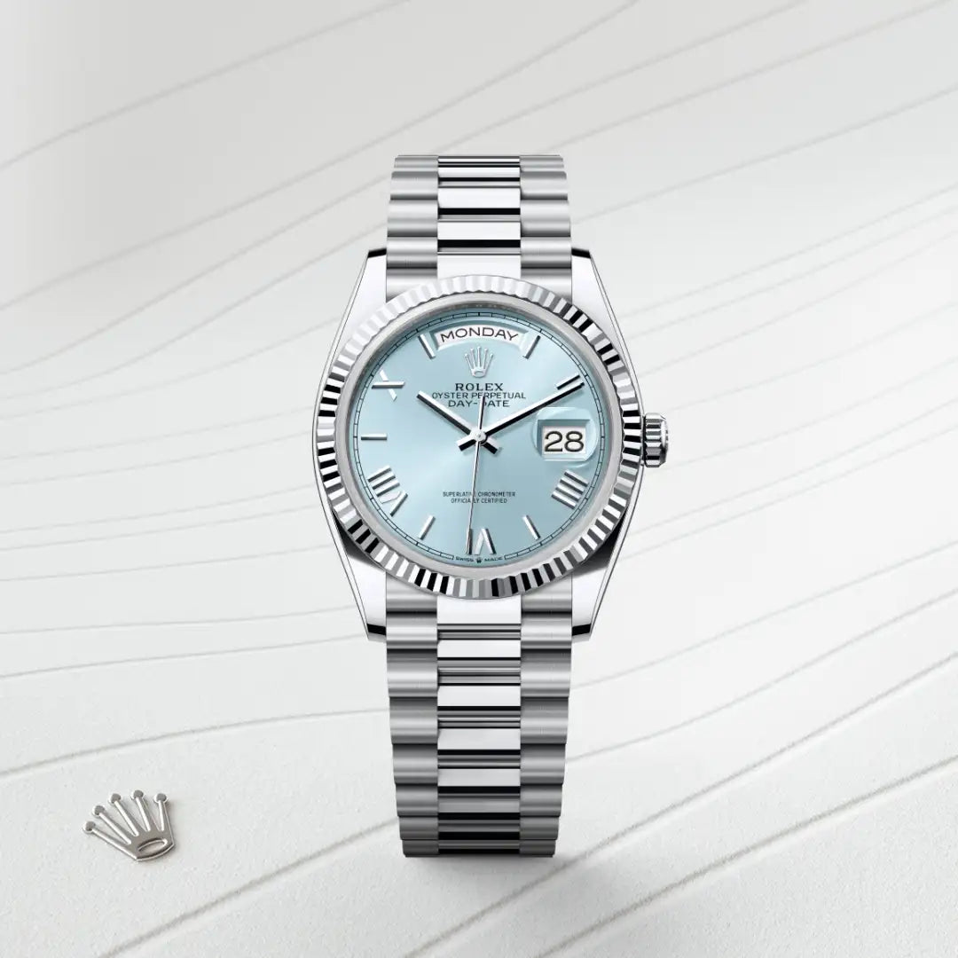 Rolex Day-Date watch with a platinum President bracelet and ice blue dial on a silver background.