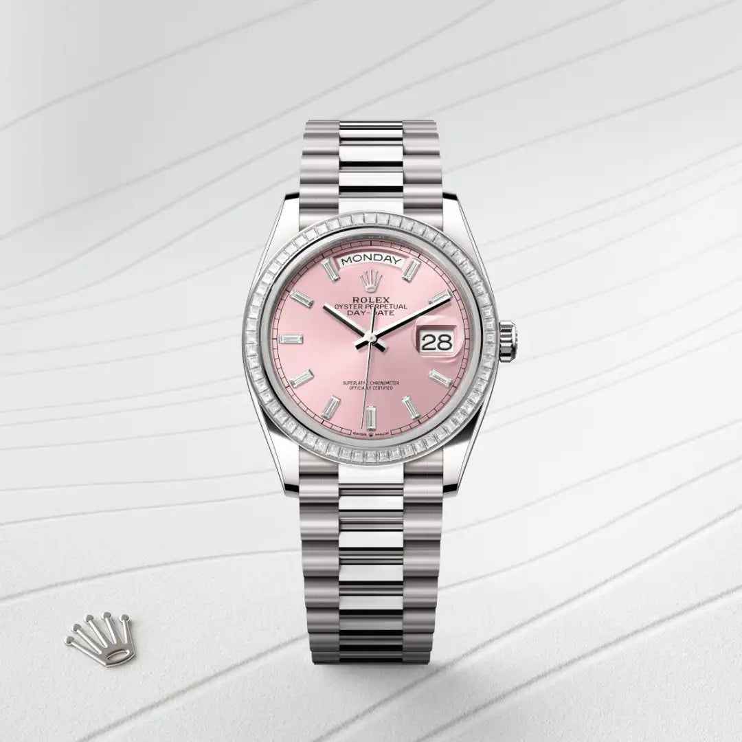 White-gold Rolex Day-Date watch with diamond bezel, President bracelet and pink dial on a silver background.