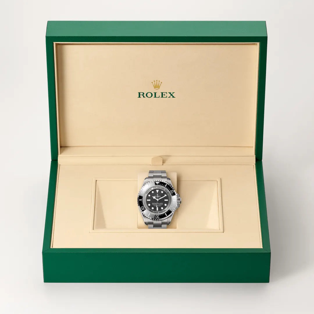 Rolex Deepsea Challenge watch in a green and beige presentation box on a light background.