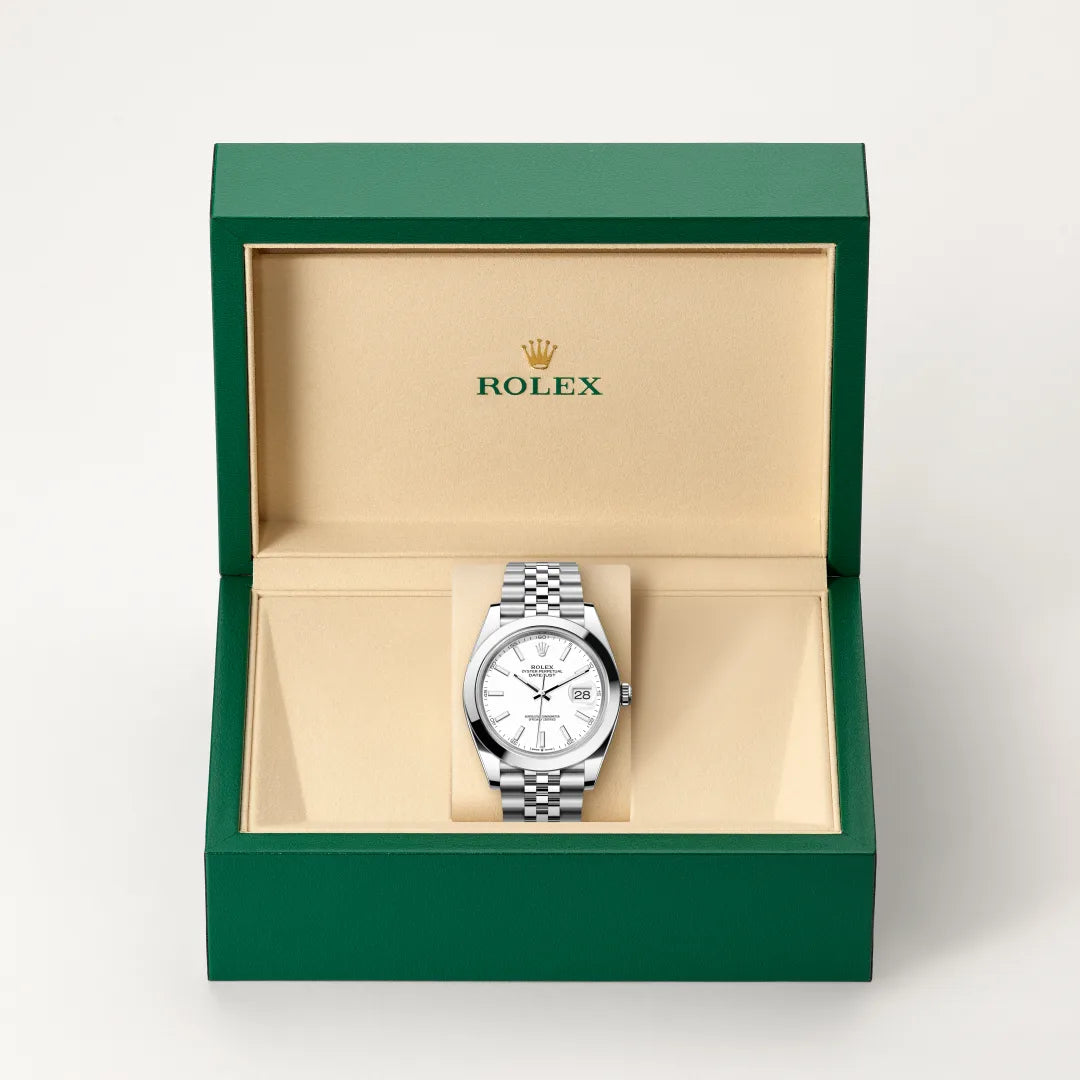 Rolex Datejust watch in a green and beige presentation box on a light background.