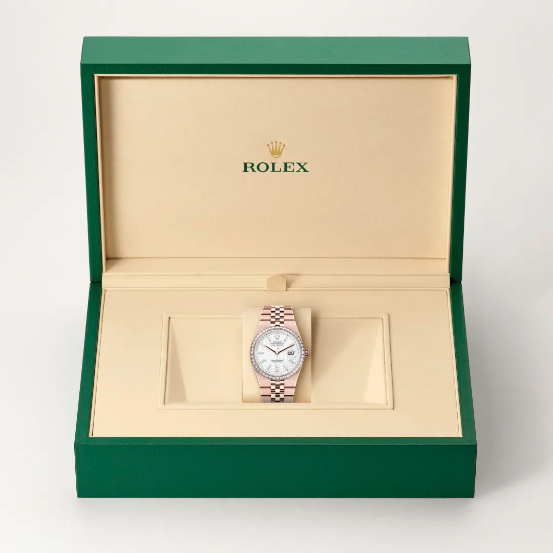 Rolex 1908 watch in a green and beige presentation box on a light background.