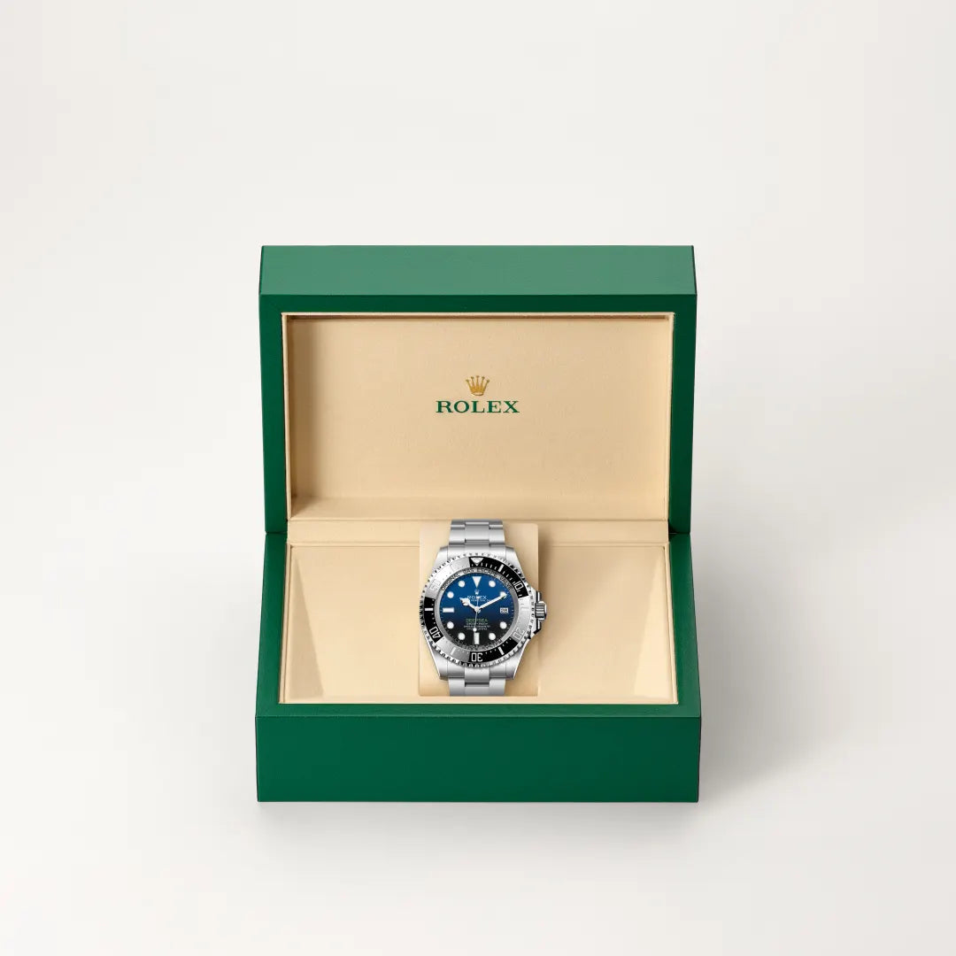 Rolex Deepsea watch in a green and beige presentation box on a light background.