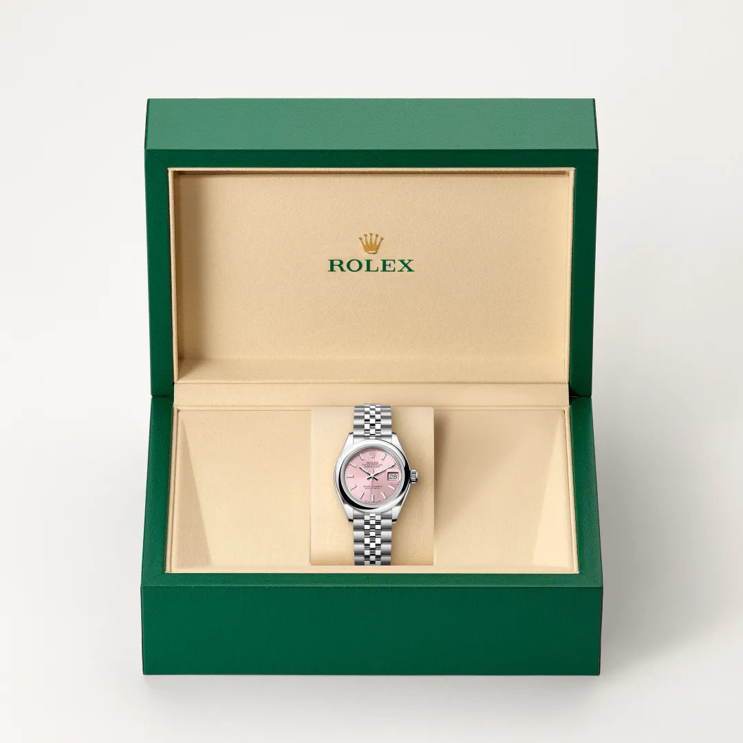 Rolex Lady-Datejust watch in a green and beige presentation box on a light background.