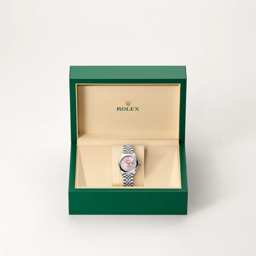 Rolex Lady-Datejust watch in a green and beige presentation box on a light background.