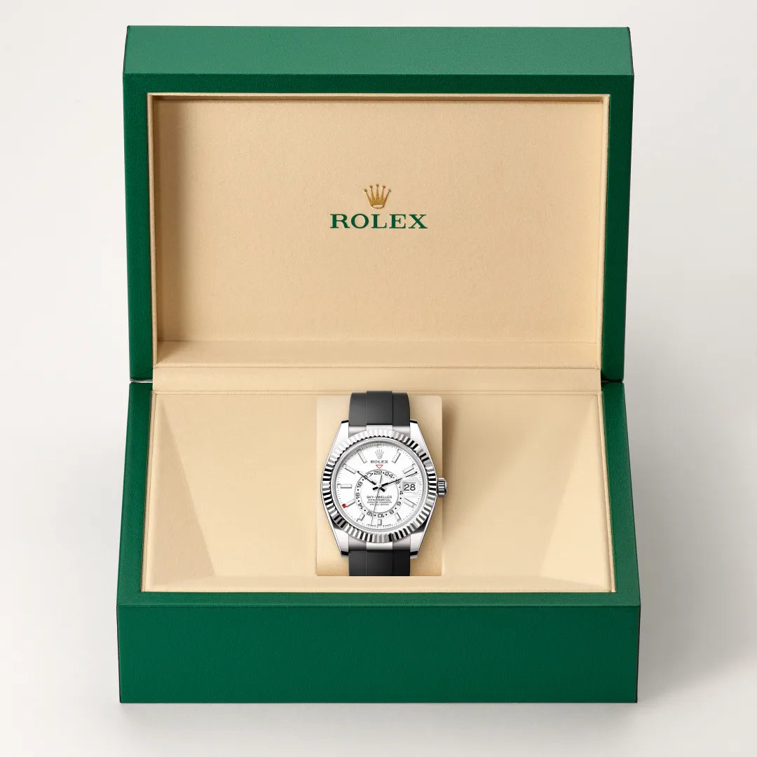 Rolex Sky-Dweller watch in a green and beige presentation box on a light background.