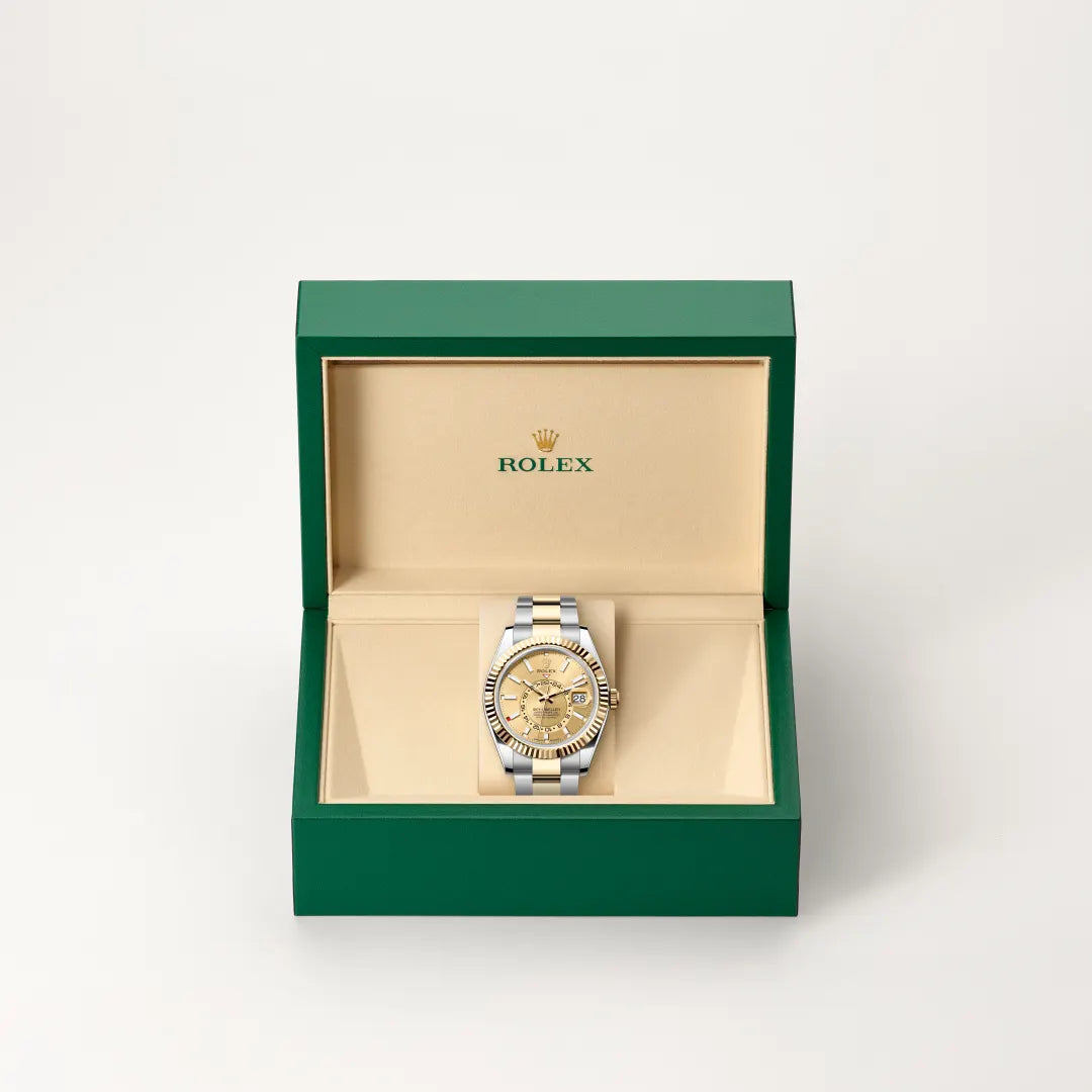 Rolex Sky-Dweller watch in a green and beige presentation box on a light background.