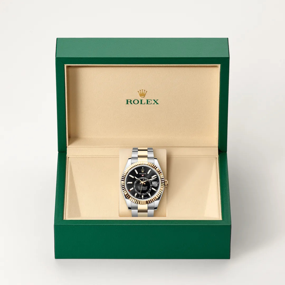 Rolex Sky-Dweller watch in a green and beige presentation box on a light background.