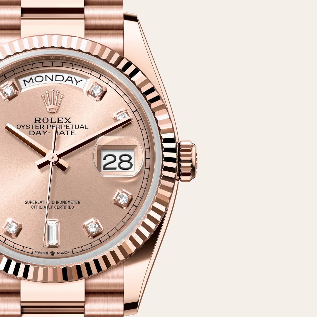 Rolex Day-Date 36 in Everose gold, with a rose-colour dial, fluted bezel, and President bracelet on a light background.