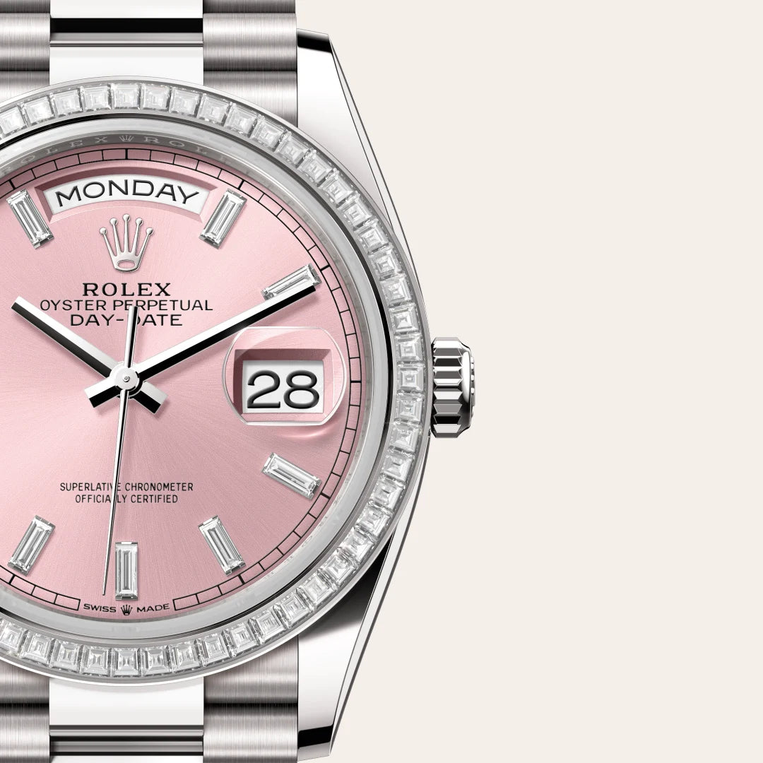 White-gold Rolex Day-Date watch with diamond bezel, President bracelet and pink dial on a light background.