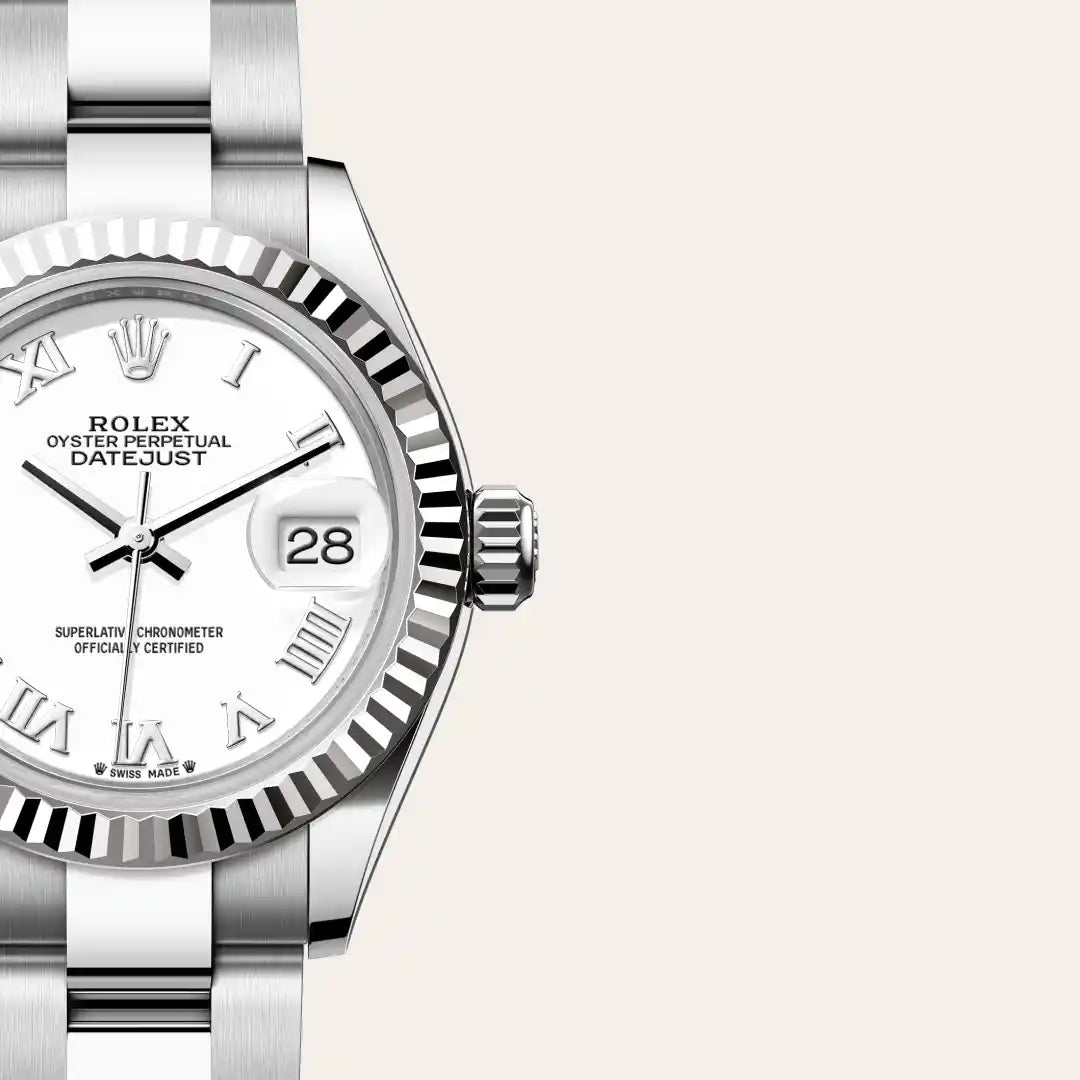 Rolex Lady-Datejust with a steel Oyster bracelet, fluted bezel and white dial on a light background.