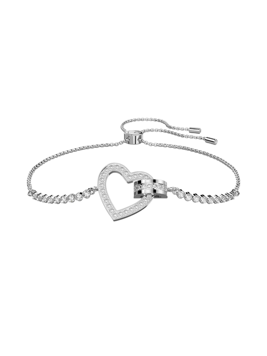 Swarovski white crystal heart bracelet with silver-colour chain on a white background.