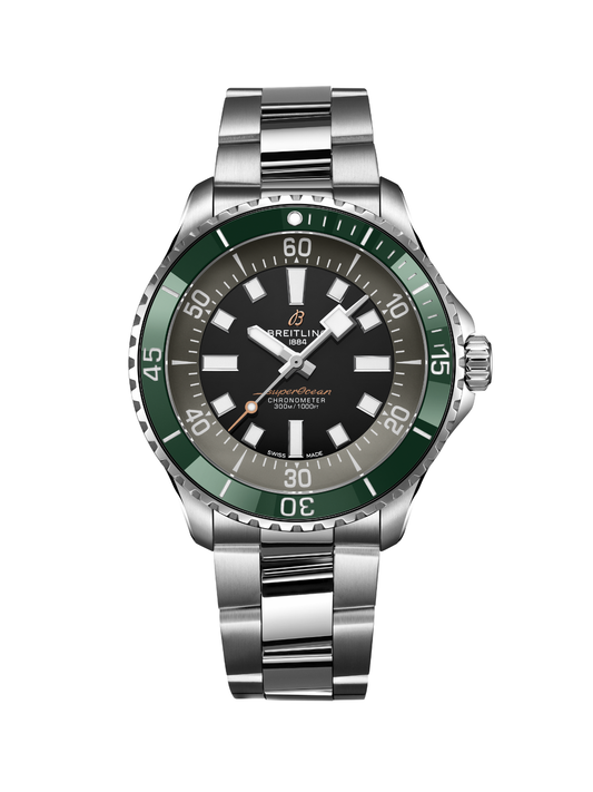 Breitling Superocean watch with a steel bracelet, green bezel, and black dial, on a black background.