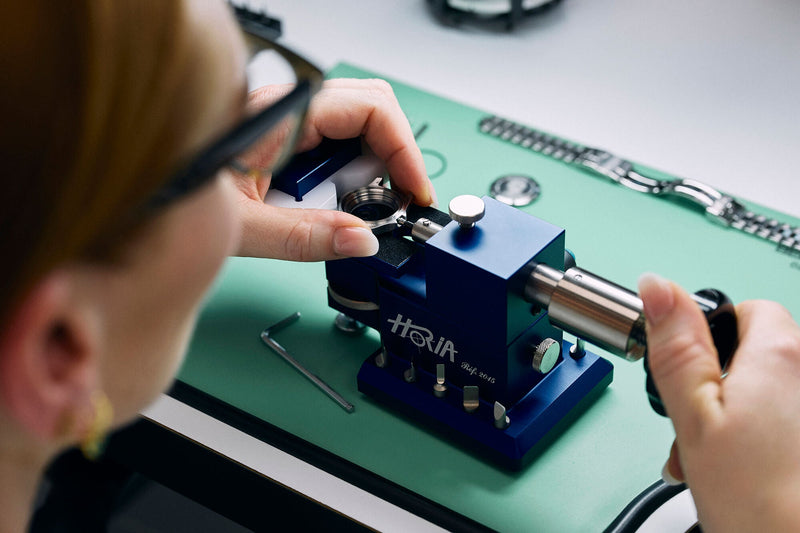 Close-up of a watch being repaired by a watchmaker.