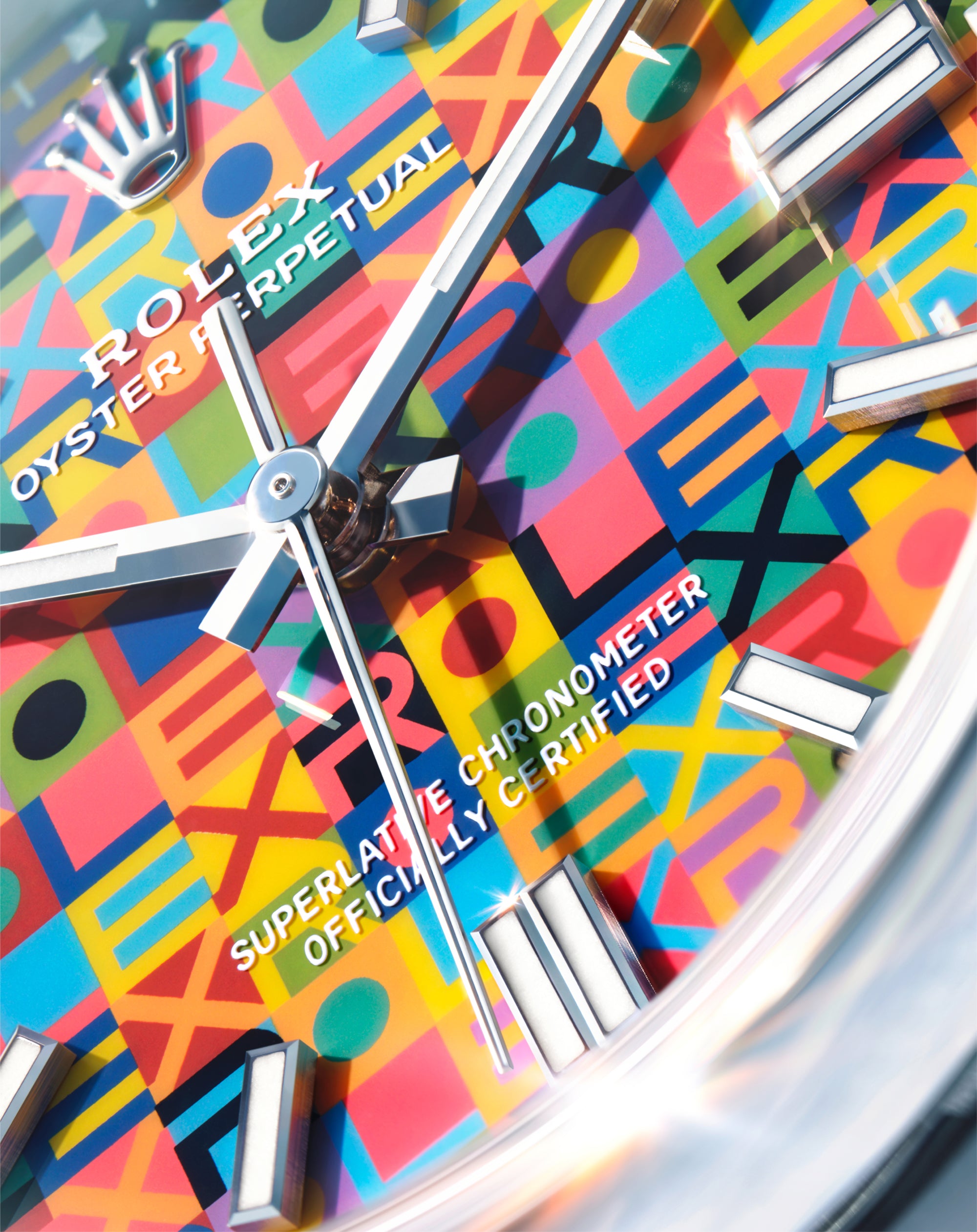 Close-up of a multicoloured Rolex watch dial.