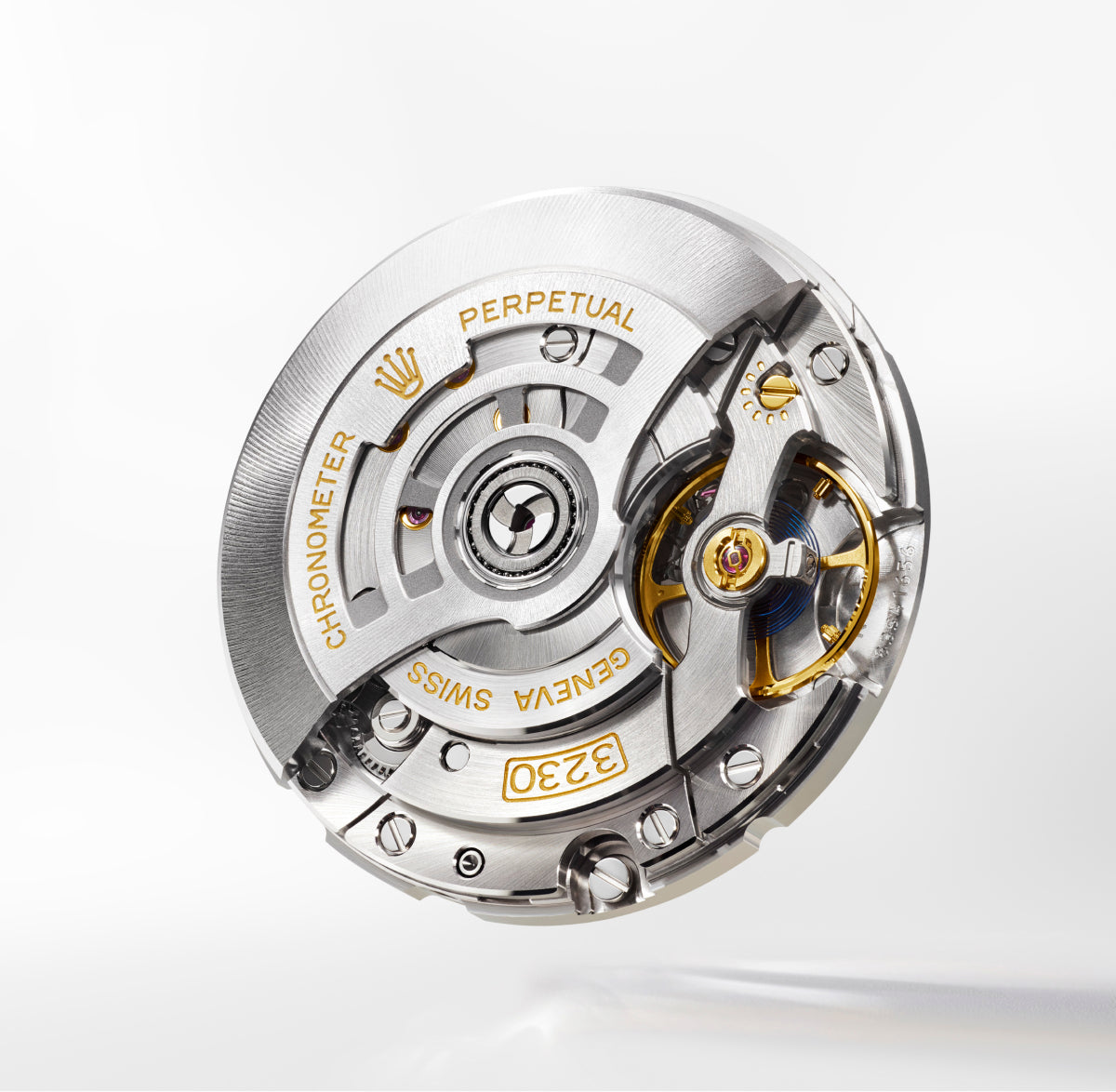 Close-up of Rolex movement 3230 on a light background.