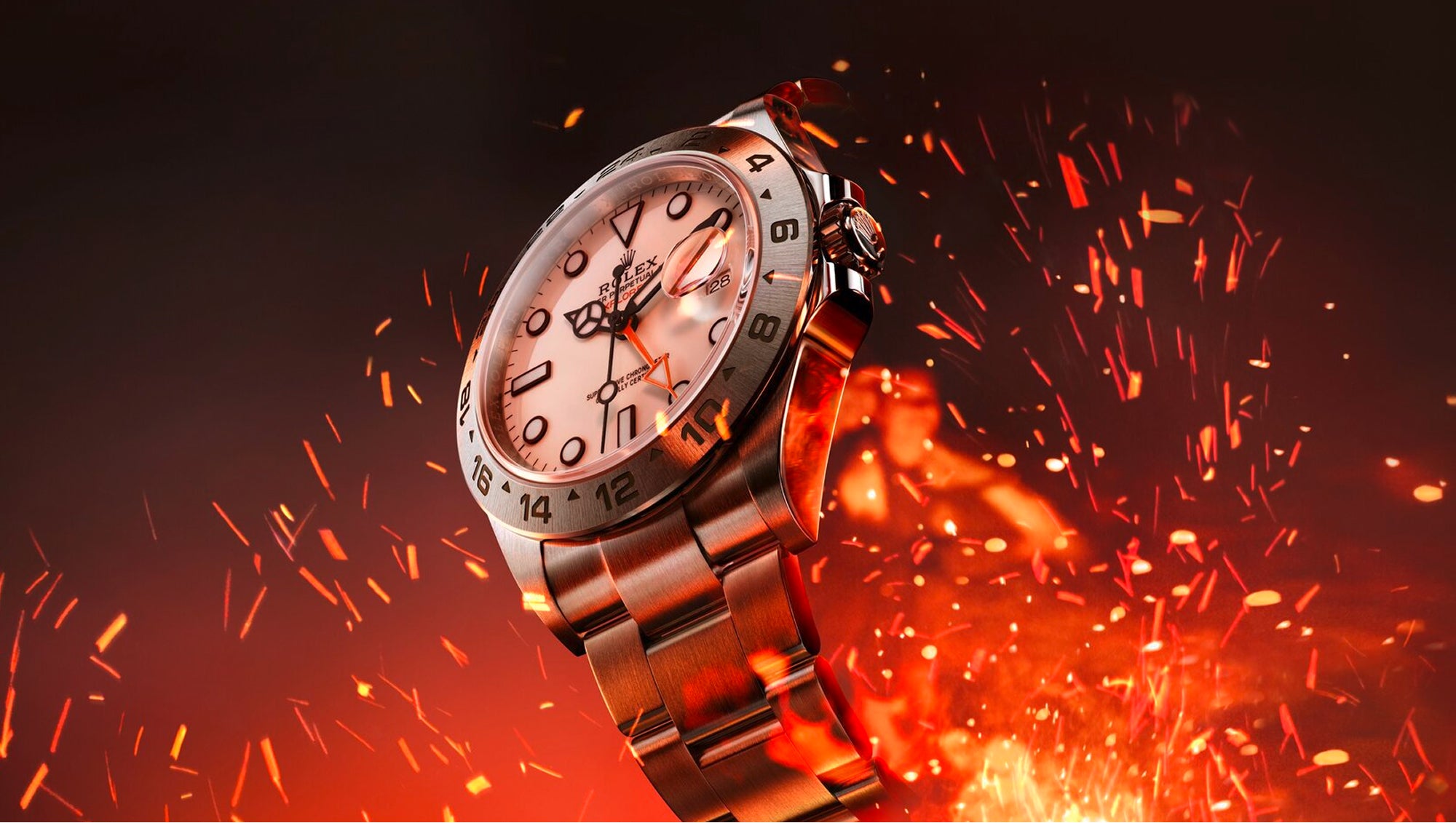 Rolex Explorer II watch with a steel bracelet and white dial on a fiery background.