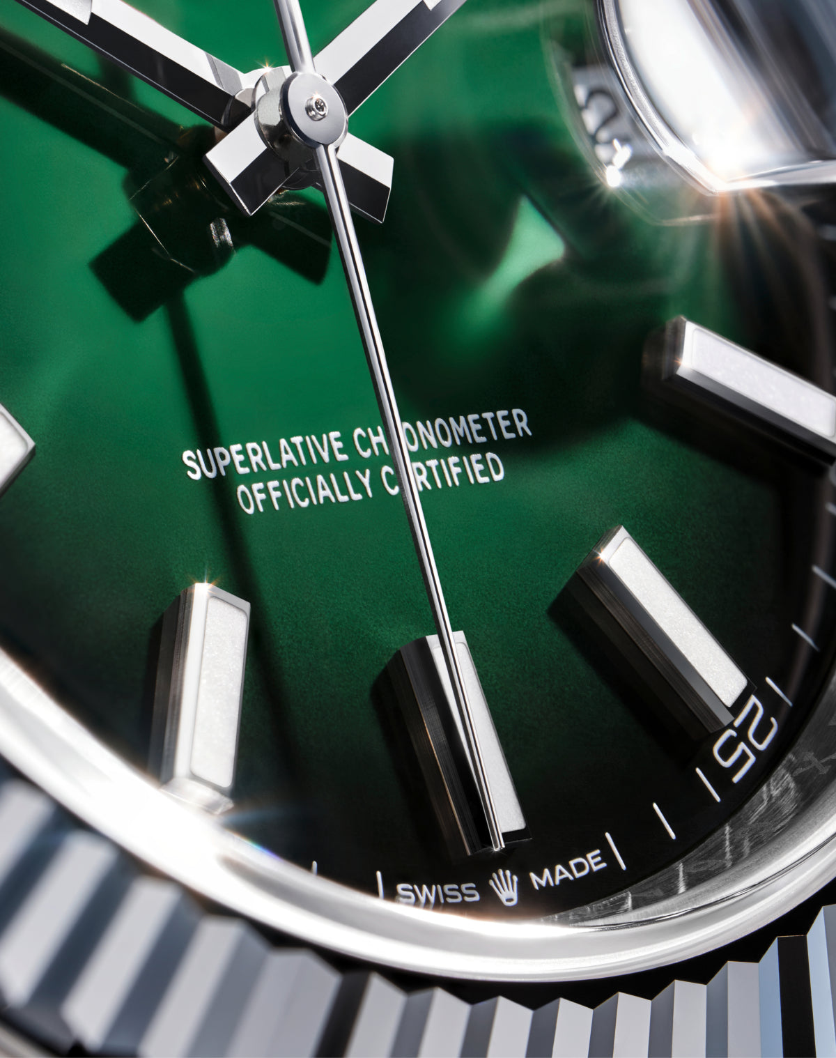 Close-up of a green Rolex watch dial.