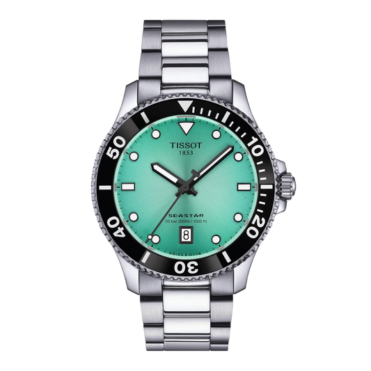 Tissot Seastar 1000 with steel bracelet and turquoise dial on a white background.