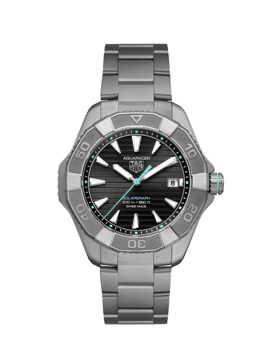 TAG Heuer Aquaracer with titanium bracelet and black dial on a white background.