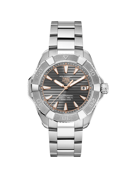TAG Heuer Aquaracer with titanium bracelet and grey dial on a white background.