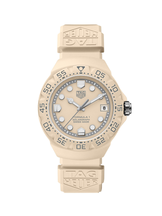 TAG Heuer Formula 1 watch with pastel beige case, rubber strap and dial, on a white background.