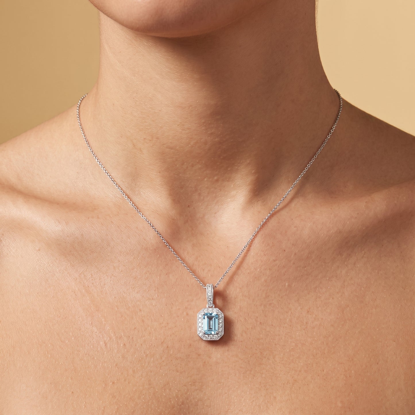 Aquamarine & Diamond Cluster Pendant with 0.45ct Emerald Cut Aquamarine and 0.15ct Diamond Halo in 18ct White Gold
