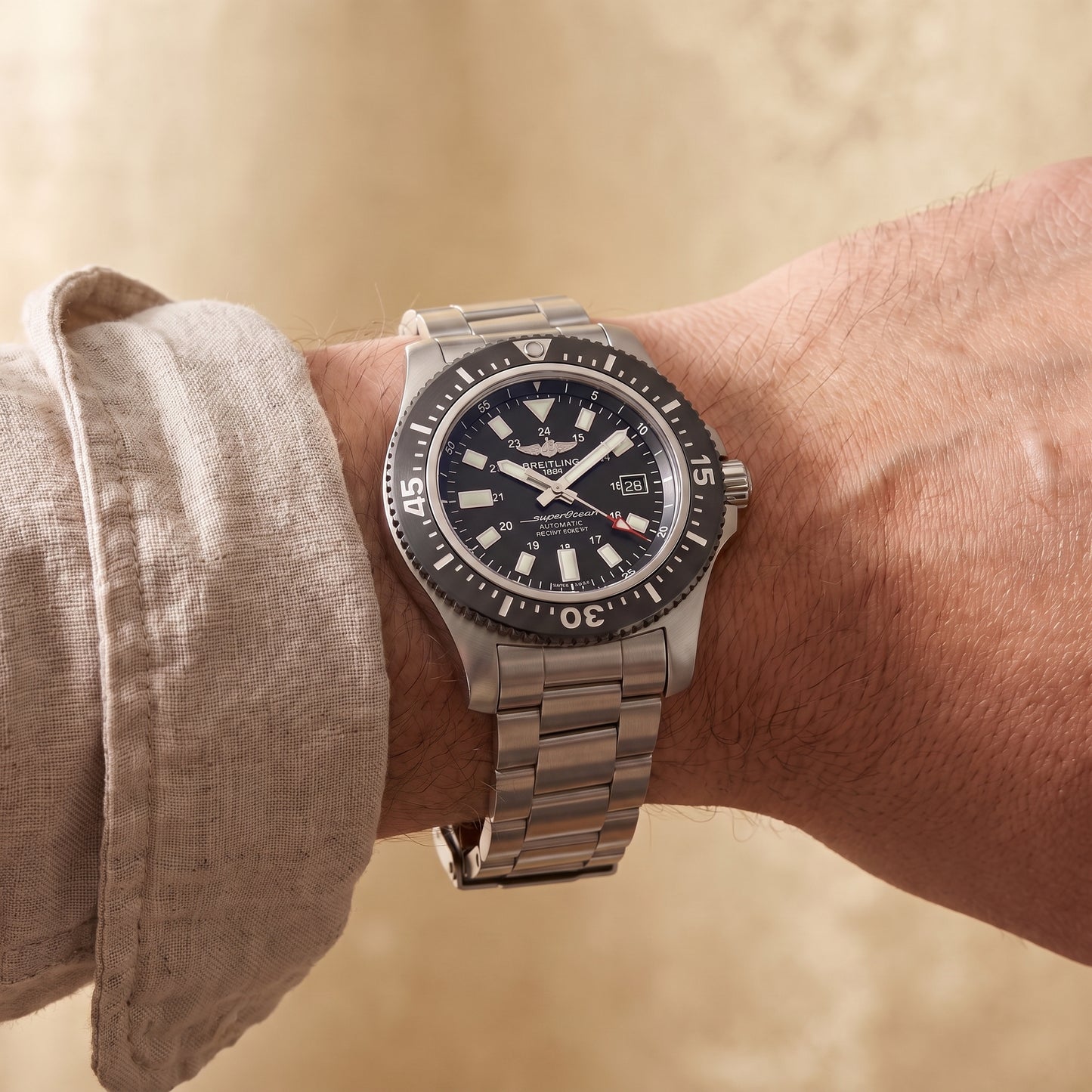 Breitling Superocean with 44mm steel case, steel bracelet and black dial on a gents wrist.