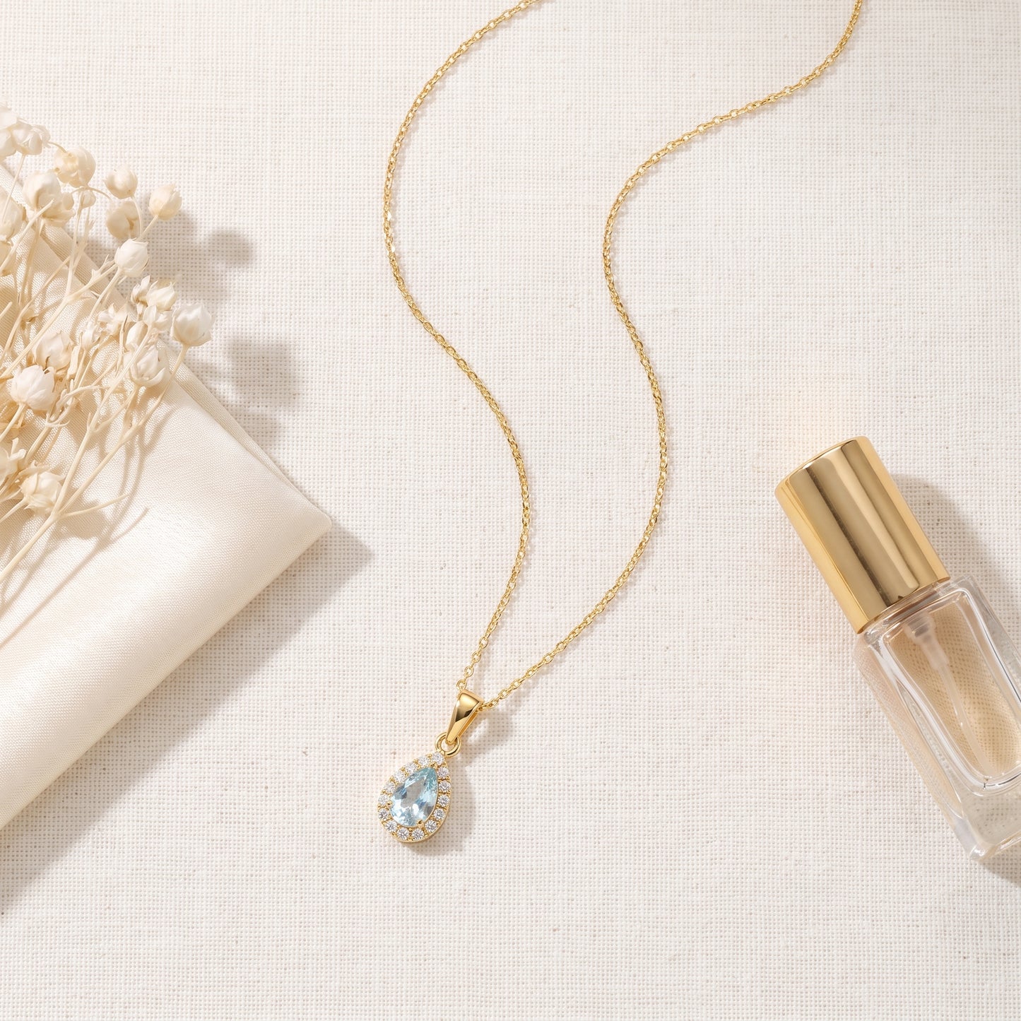 Aquamarine & Diamond Cluster Pendant with 0.19ct Pear Cut Aquamarine and 0.04ct Diamond Halo in 18ct Yellow Gold