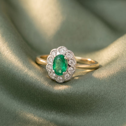 Emerald & Diamond Cluster Ring with 7x5mm Emerald and 0.10ct of Round Brilliant Diamonds in 9ct Yellow & White Gold
