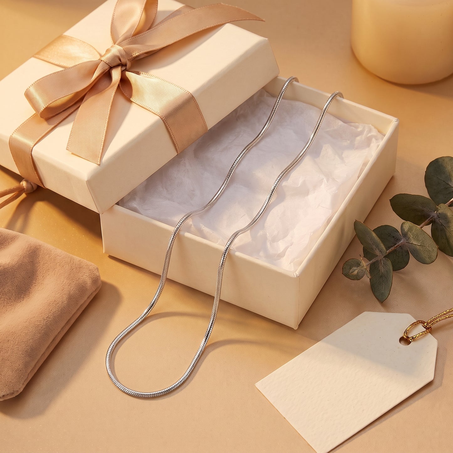 Silver fancy snake chain with trigger clasp in a cream presentation box.