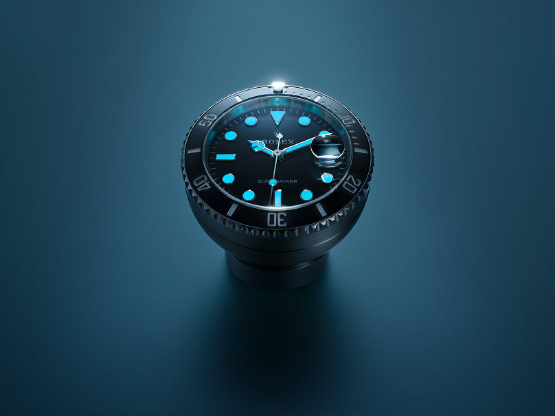 Rolex Submariner Date desk clock on a blue background.