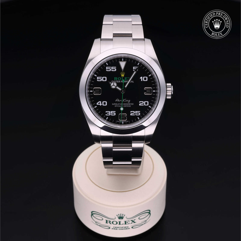 Rolex Air-King watch with a steel Oyster bracelet and black dial on a black background.Air-King