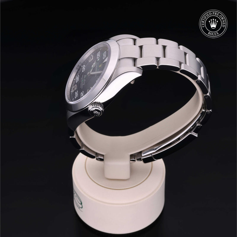 Rolex Air-King watch with a steel Oyster bracelet and black dial on a black background.Air-King