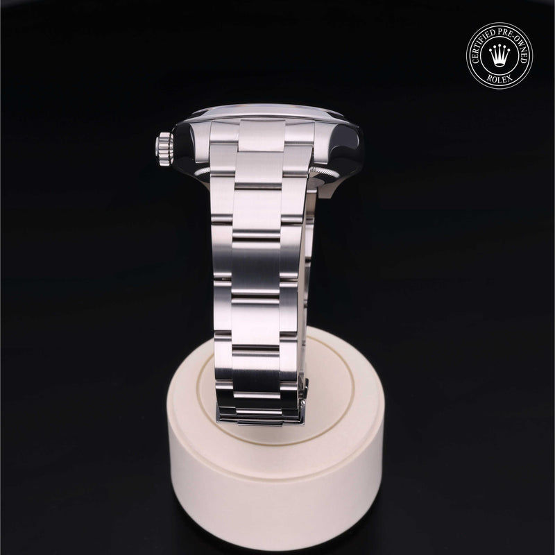 Rolex Air-King watch with a steel Oyster bracelet and black dial on a black background.Air-King