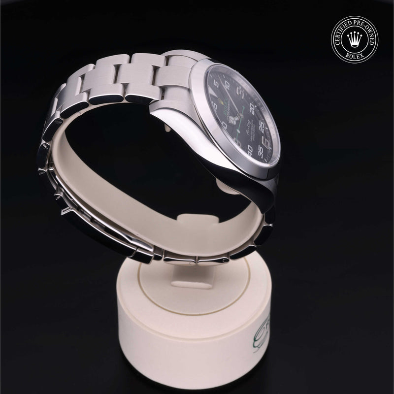 Rolex Air-King watch with a steel Oyster bracelet and black dial on a black background.Air-King