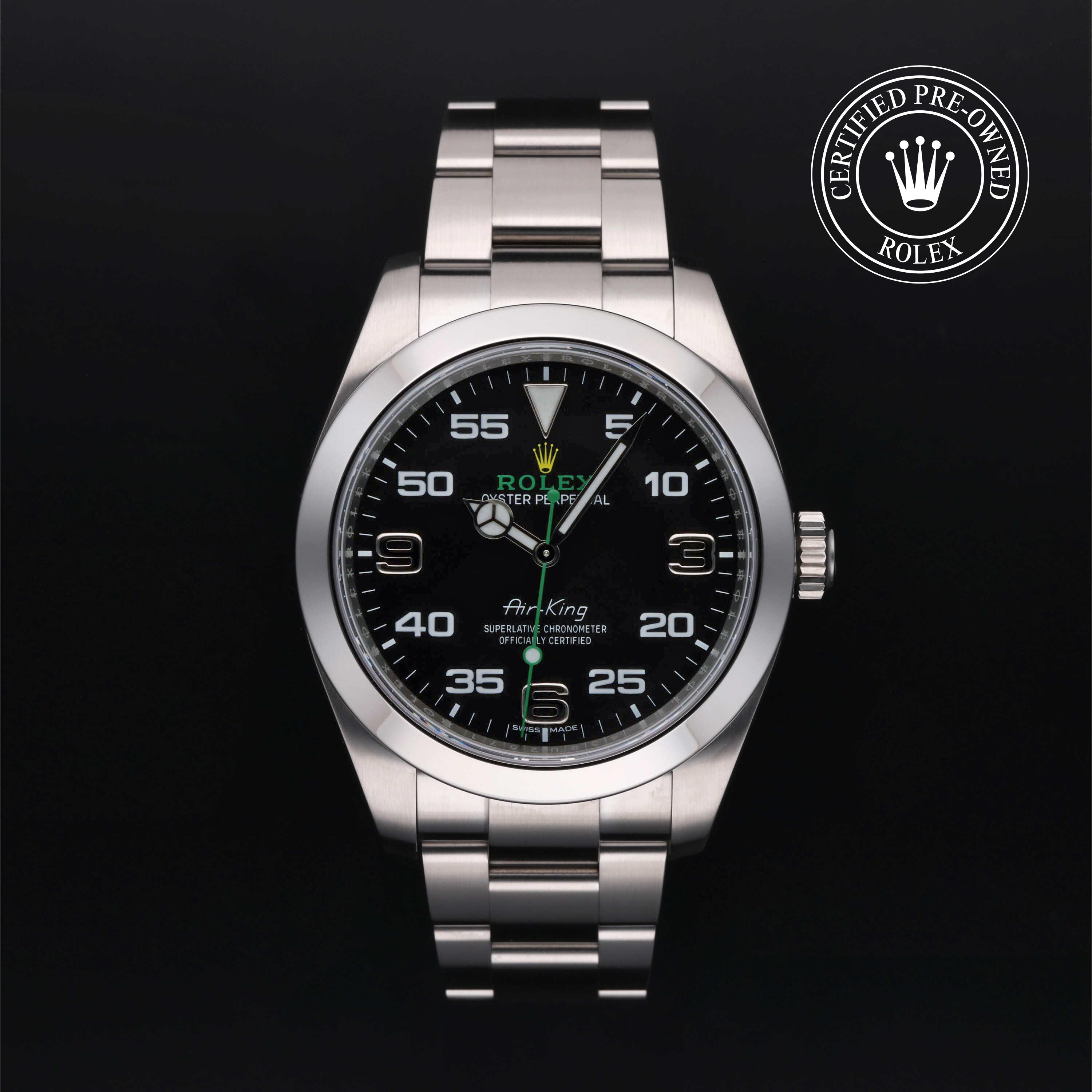 Rolex Air-King watch with a steel Oyster bracelet and black dial on a black background.