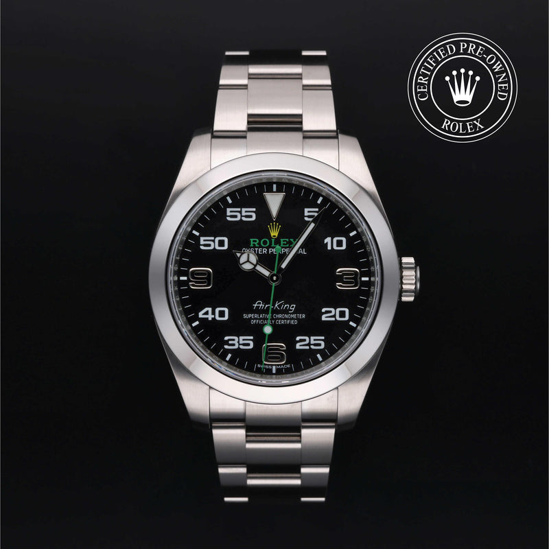 Rolex Air-King watch with a steel Oyster bracelet and black dial on a black background.