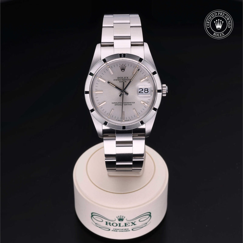 Rolex Date 34 with steel Oyster bracelet and silver dial on a black background.Date 34