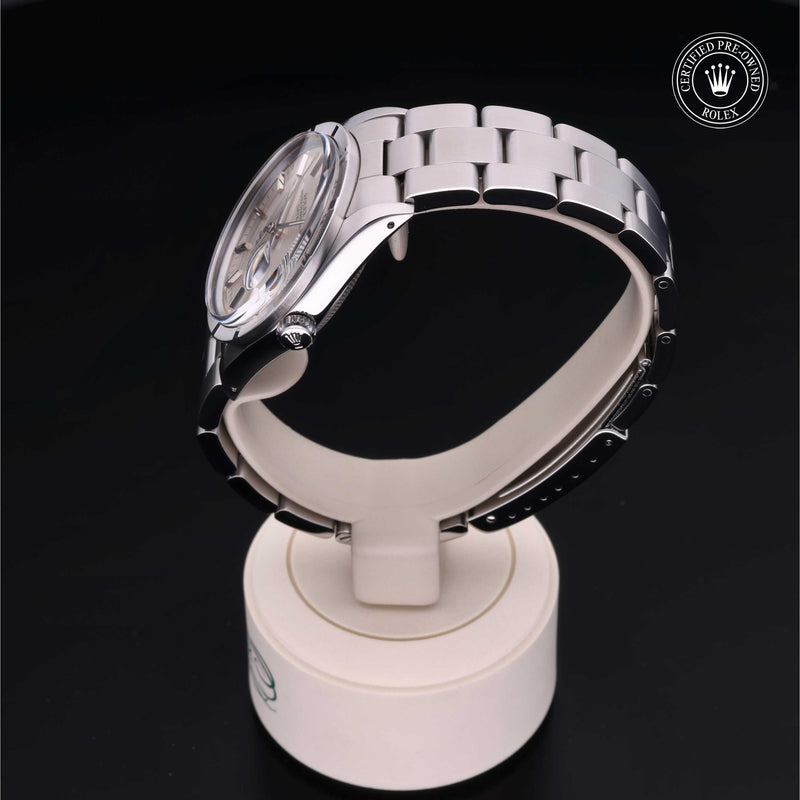 Rolex Date 34 with steel Oyster bracelet and silver dial on a black background.Date 34