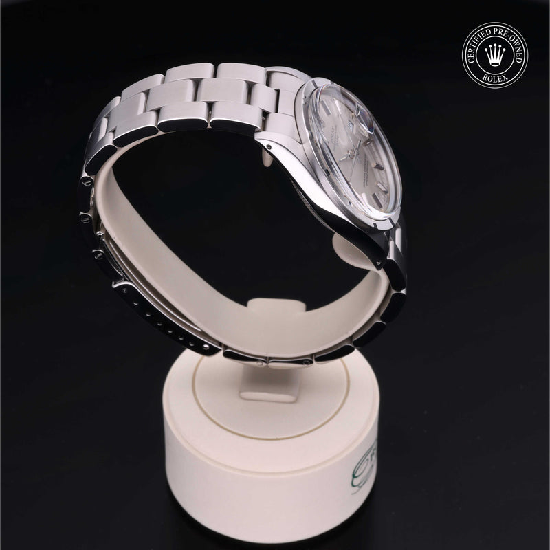 Rolex Date 34 with steel Oyster bracelet and silver dial on a black background.Date 34