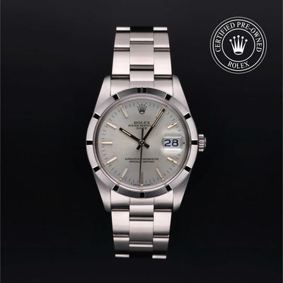 Rolex Date 34 with steel Oyster bracelet and silver dial on a black background.