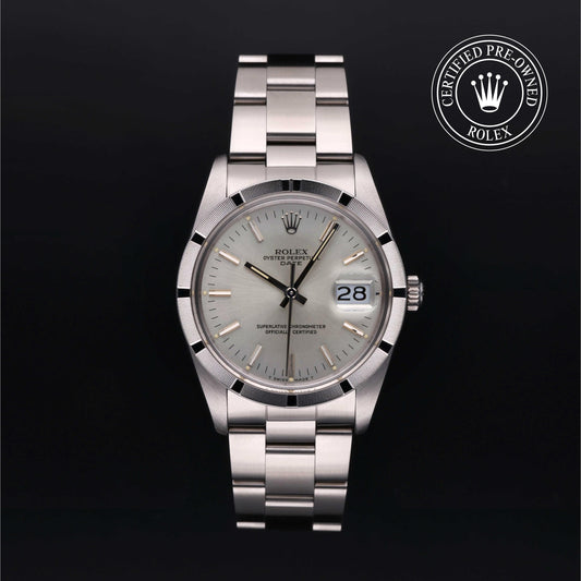 Rolex Date 34 with steel Oyster bracelet and silver dial on a black background.