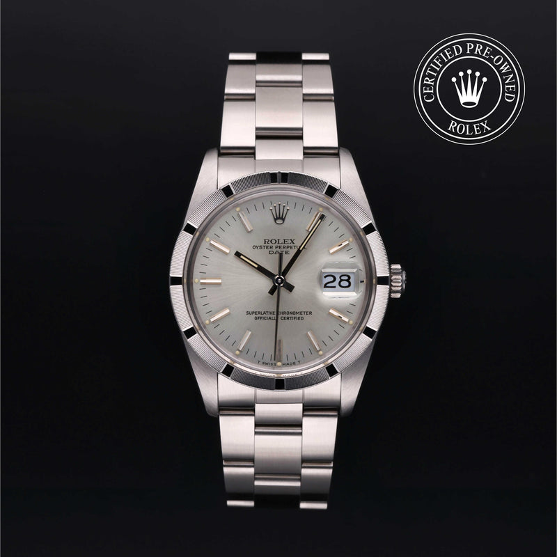 Rolex Date 34 with steel Oyster bracelet and silver dial on a black background.
