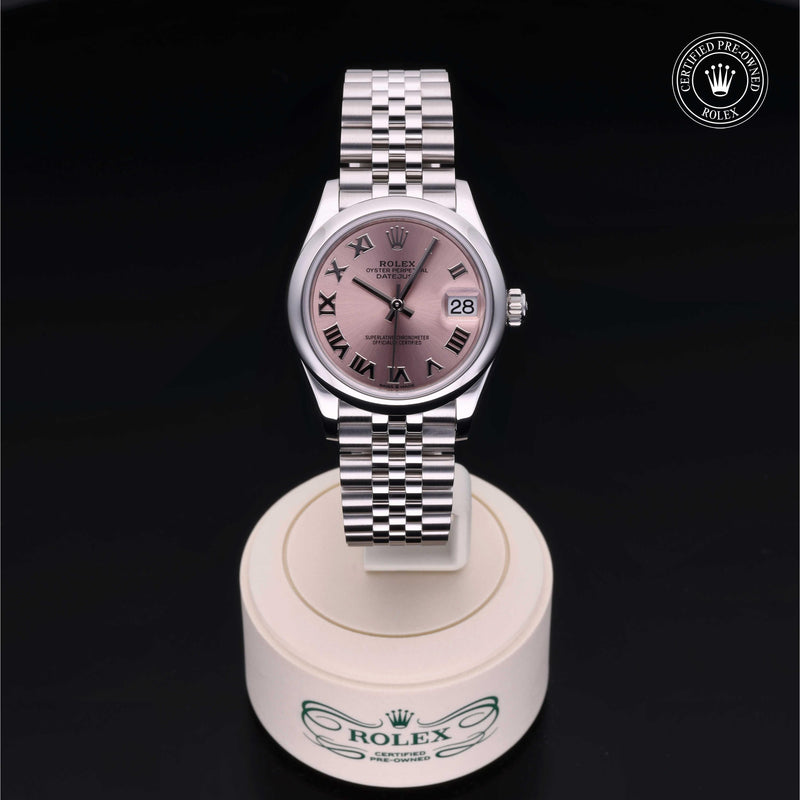 Rolex Datejust watch with a steel Jubilee bracelet and pink dial on a black background.Datejust 31
