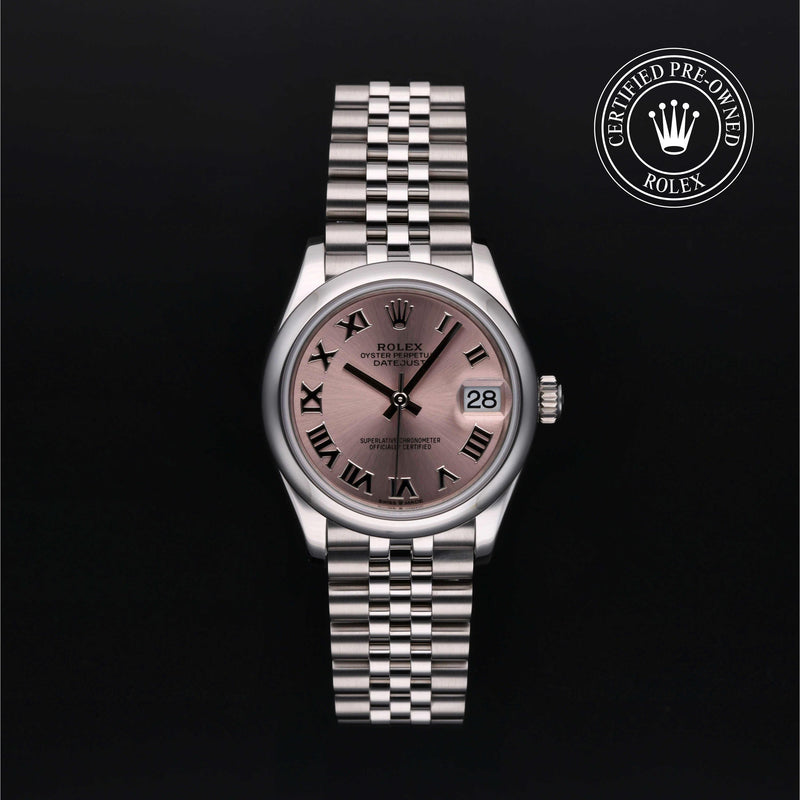 Rolex Datejust watch with a steel Jubilee bracelet and pink dial on a black background.