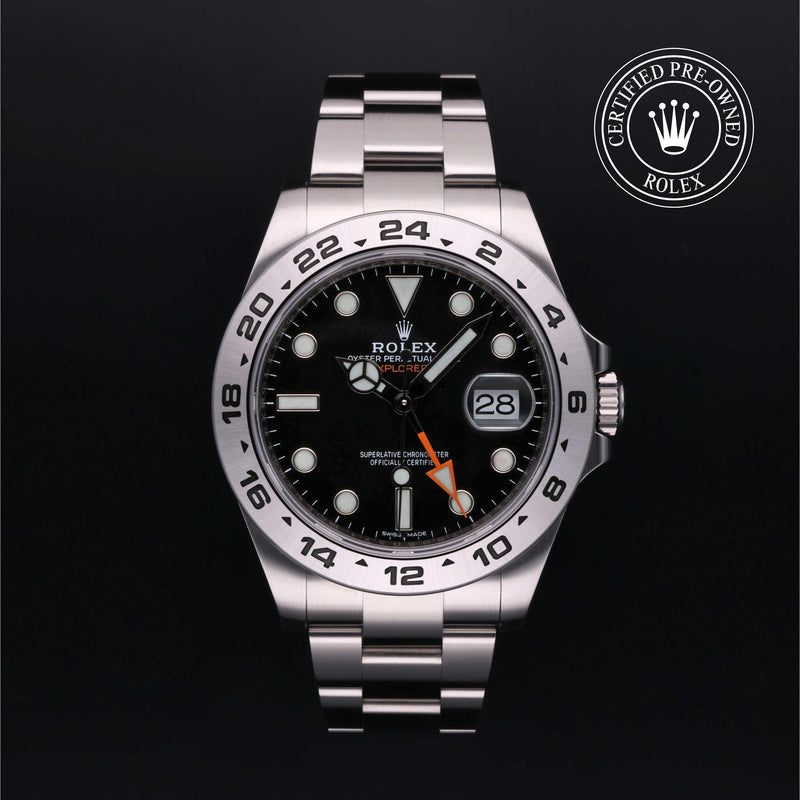 Rolex Explorer II with steel Oyster bracelet and black dial, on a black background with CPO logo.