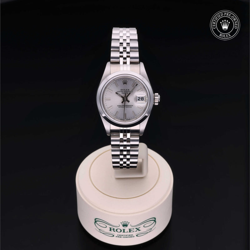 Rolex Lady-Datejust with steel Jubilee bracelet and silver dial on a presentation stand against a black background.Lady-Datejust 26