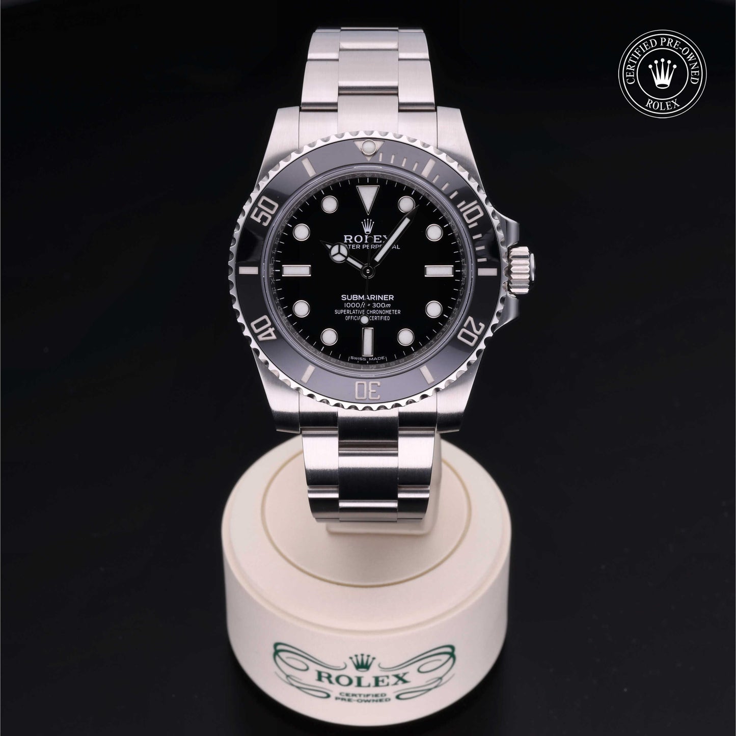Rolex Submariner watch with steel Oyster bracelet and black dial on a white background.